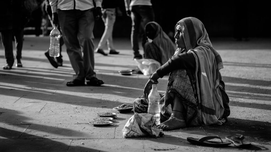 Poor women selling peanuts on the street